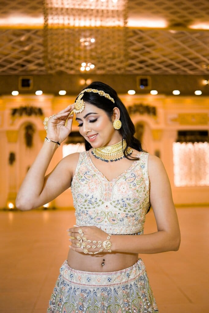 pexels-photo-28080455-28080455 South Asian woman in an ornate dress indoors, exuding elegance and grace.
