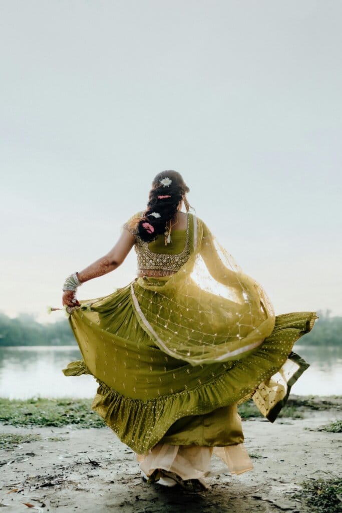pexels-photo-28269983-28269983 A woman in traditional attire dances gracefully by a river in Dinajpur, Bangladesh.