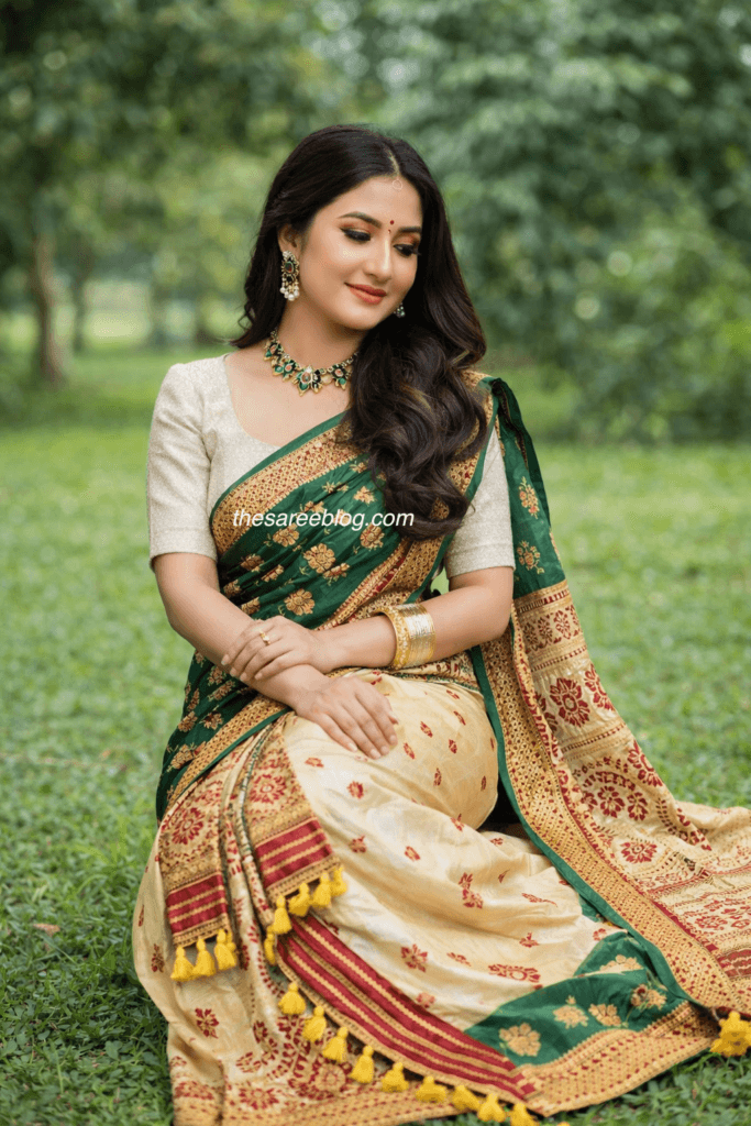 women sitting wearing assamese mekhela chador